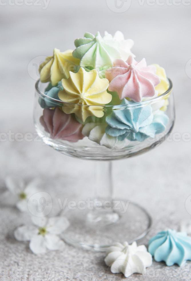 Small colorful meringues in the glass photo