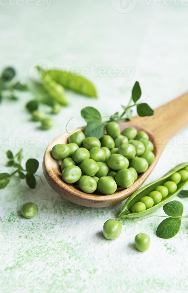 Fresh green peas pods and green peas photo