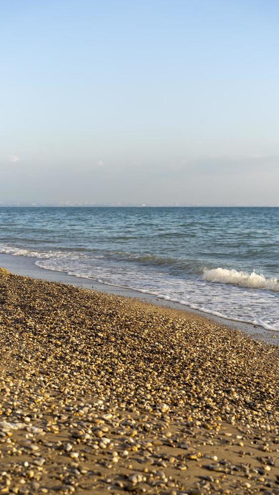 Seascape with a pebble beach photo