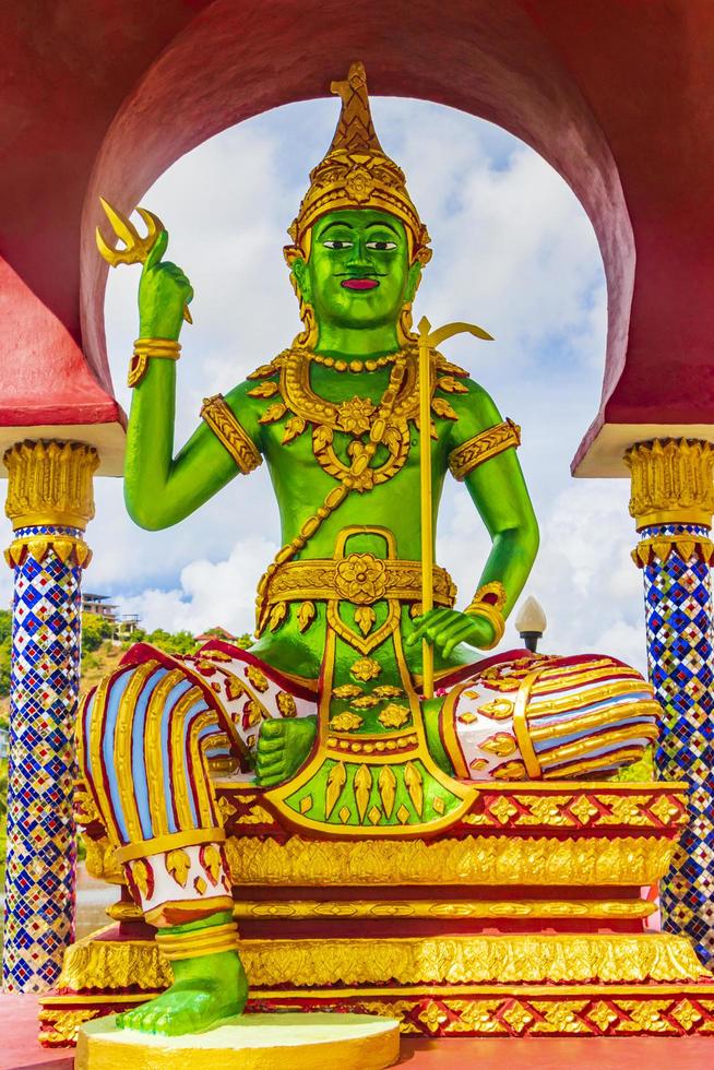 Green god statues and architecture at Wat Plai Laem temple, on Koh Samui island, Thailand photo