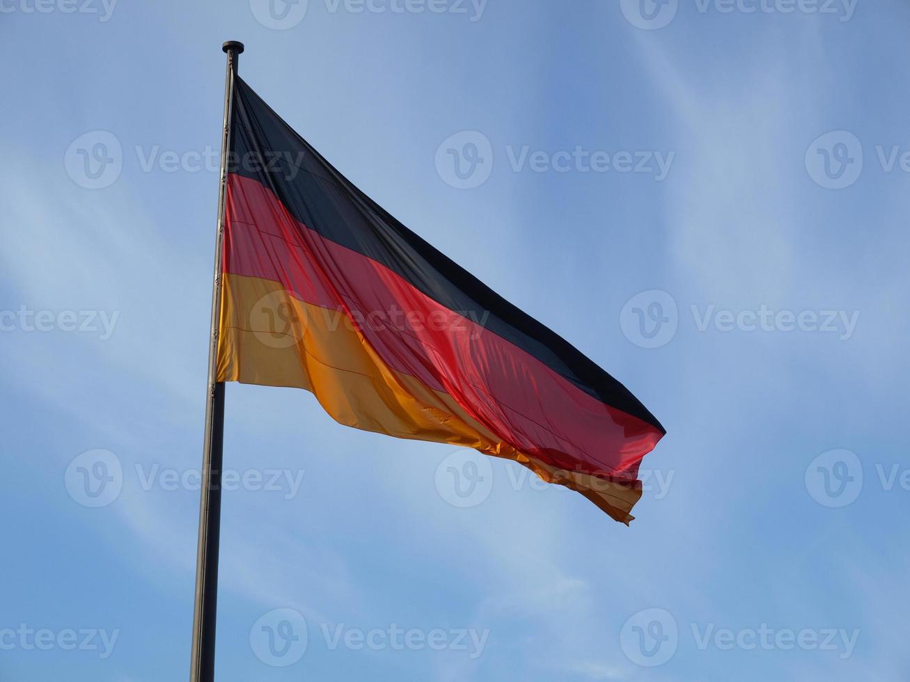 German flag over blue sky photo