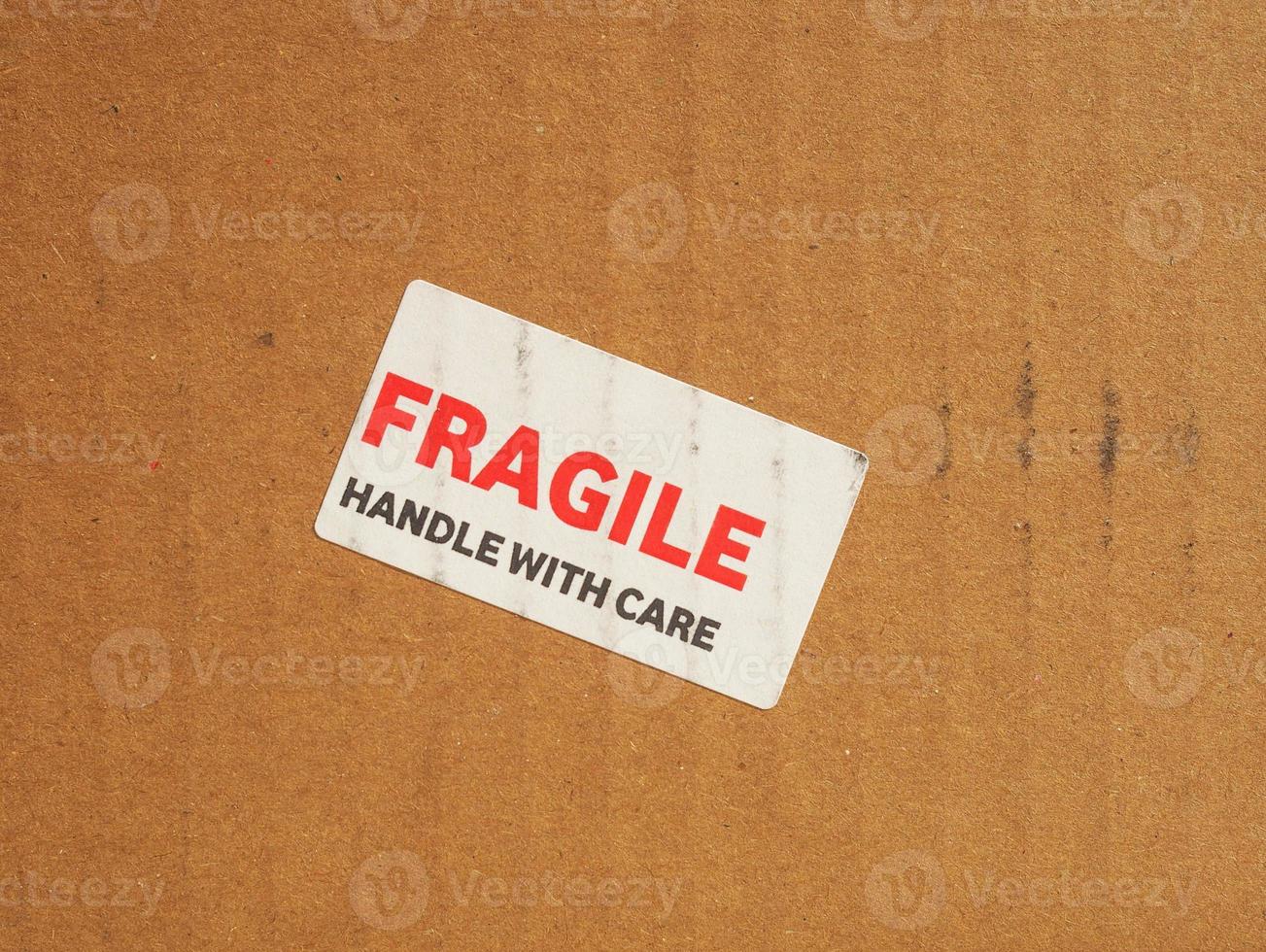 Mango frágil con signo de cuidado foto