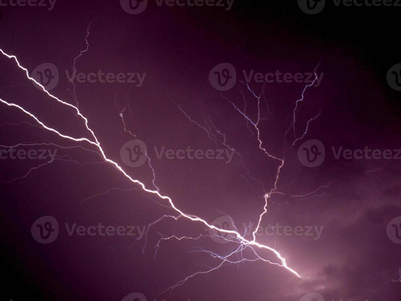 Lightning bolt at night photo