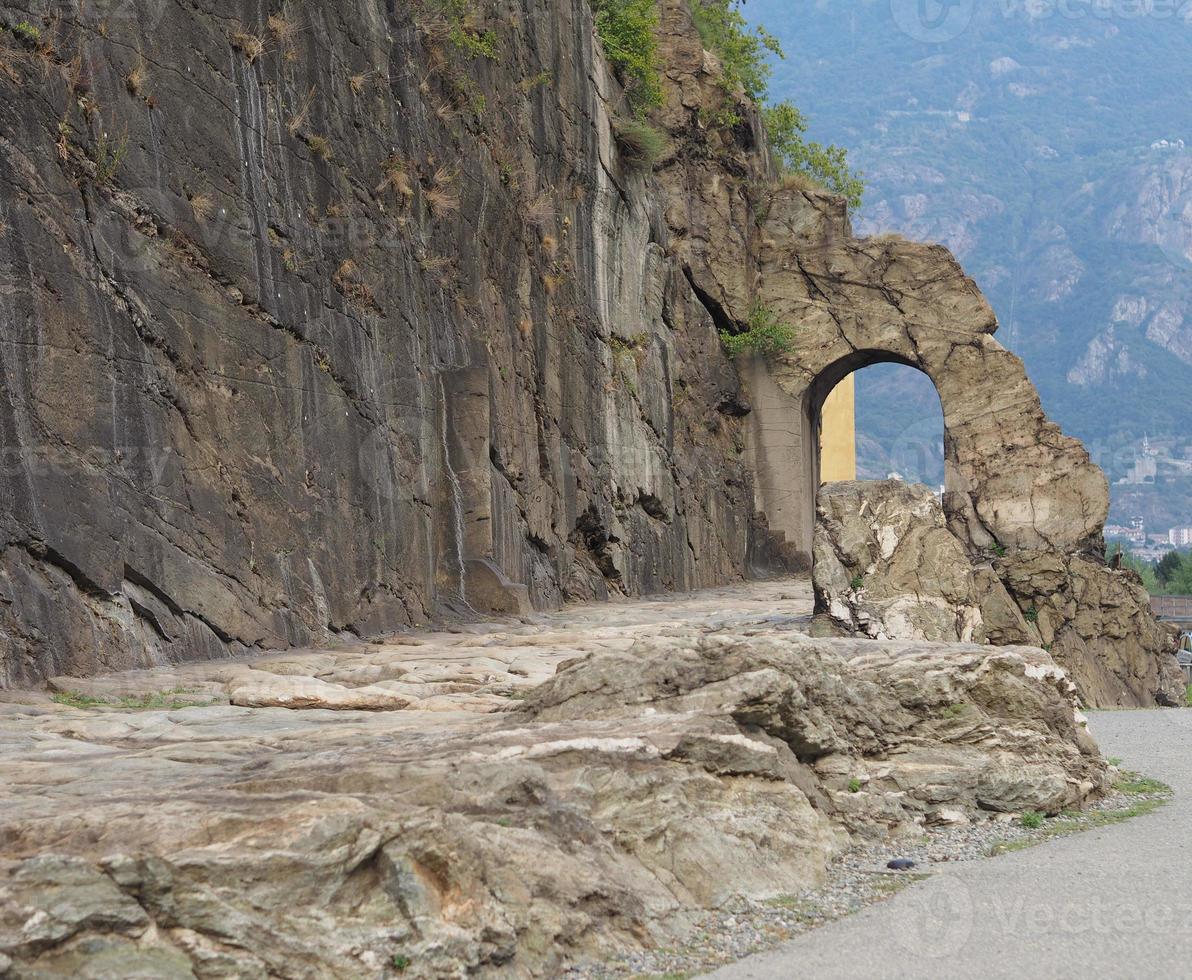 Ancient roman road arch in Donnas photo