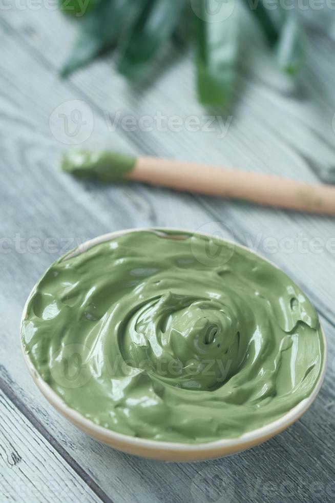 bubble clay mask in container on white background photo