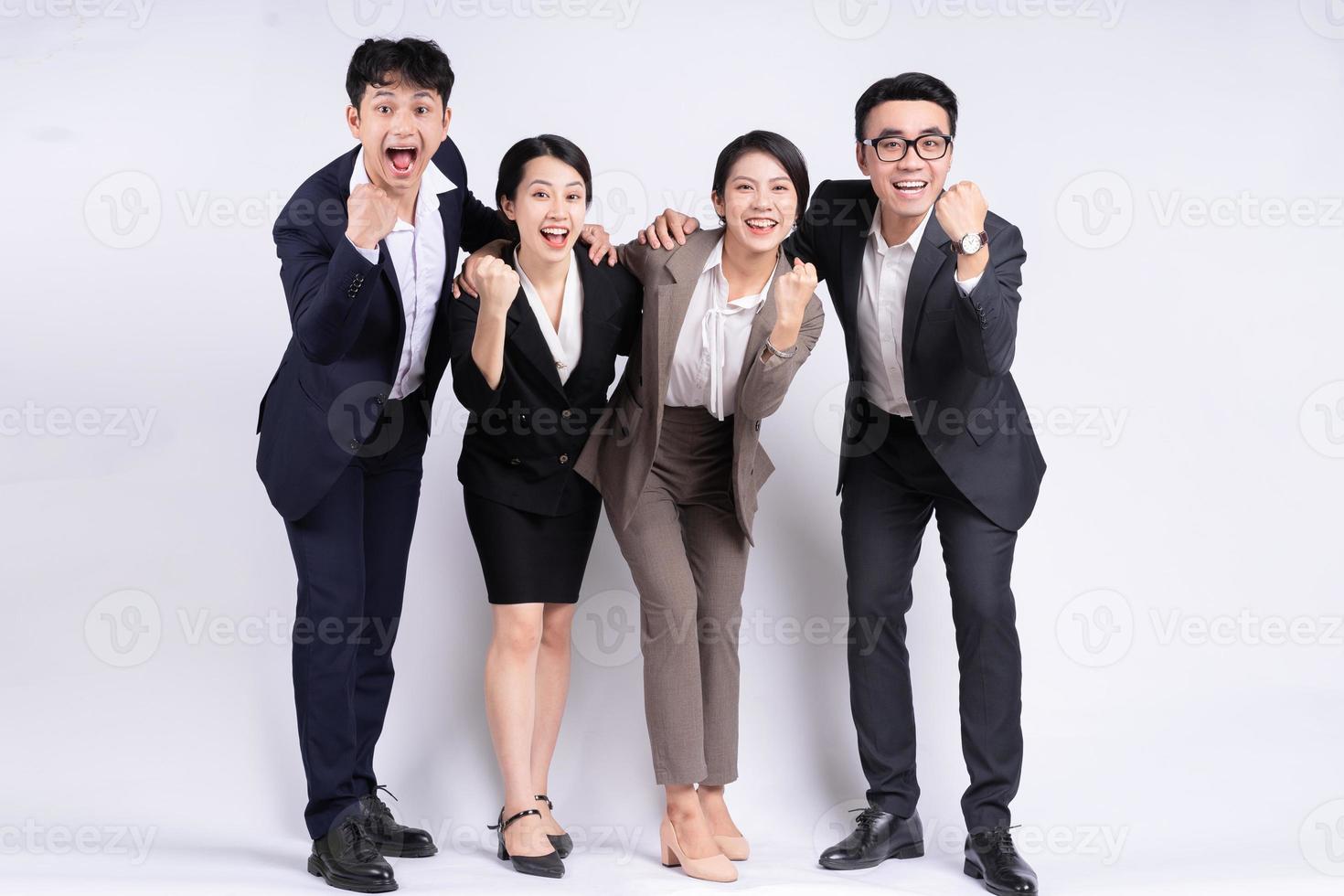 Group of Asian business people posing on a white background photo