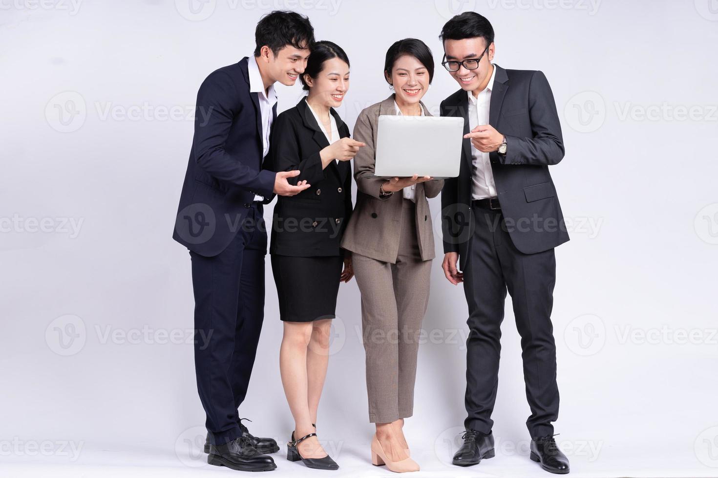 Group of Asian business people posing on a white background photo