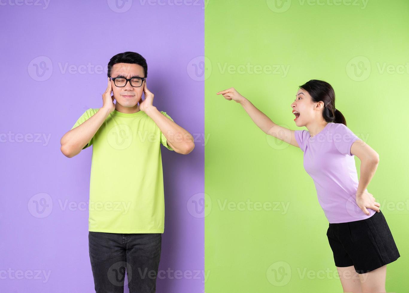 Young Asian couple arguing with each other, long distance love concept photo