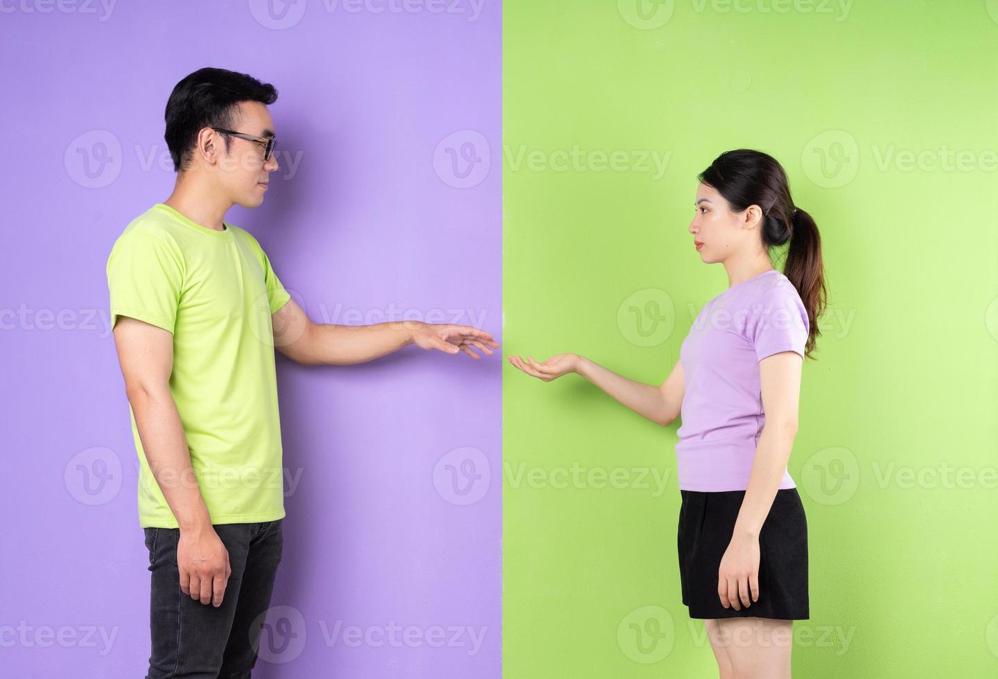 Young Asian couple trying to touch each other photo