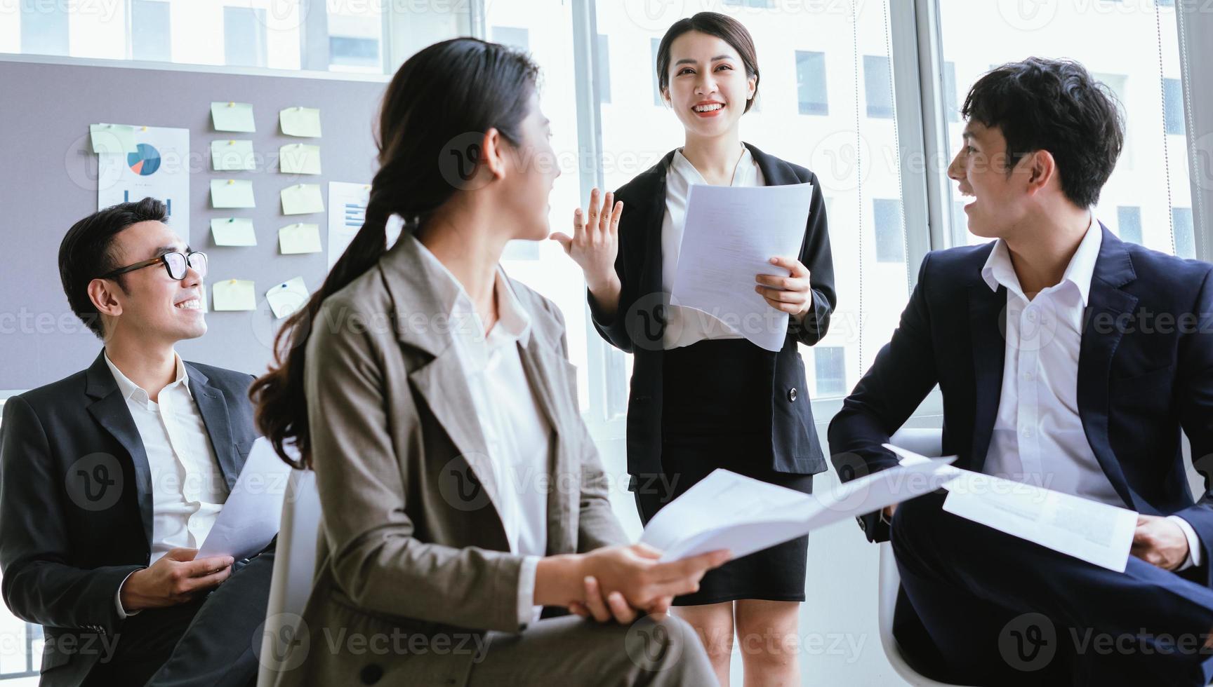 Portrait of Asian businesswoman presenting her plan in a meeting photo