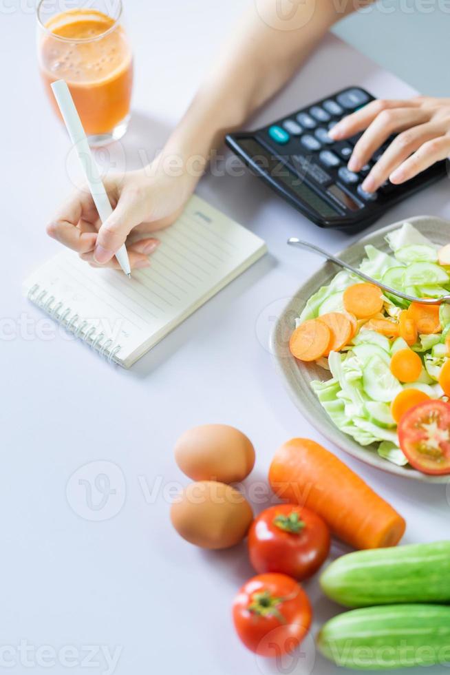 Young Asian woman with healthy meals photo