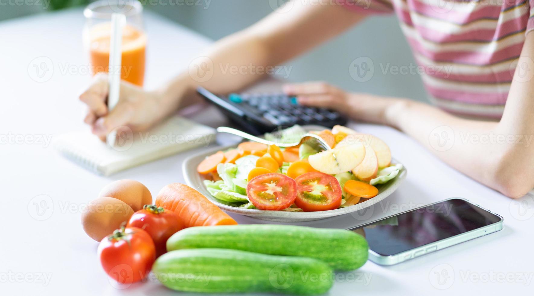 Young Asian woman with healthy meals photo