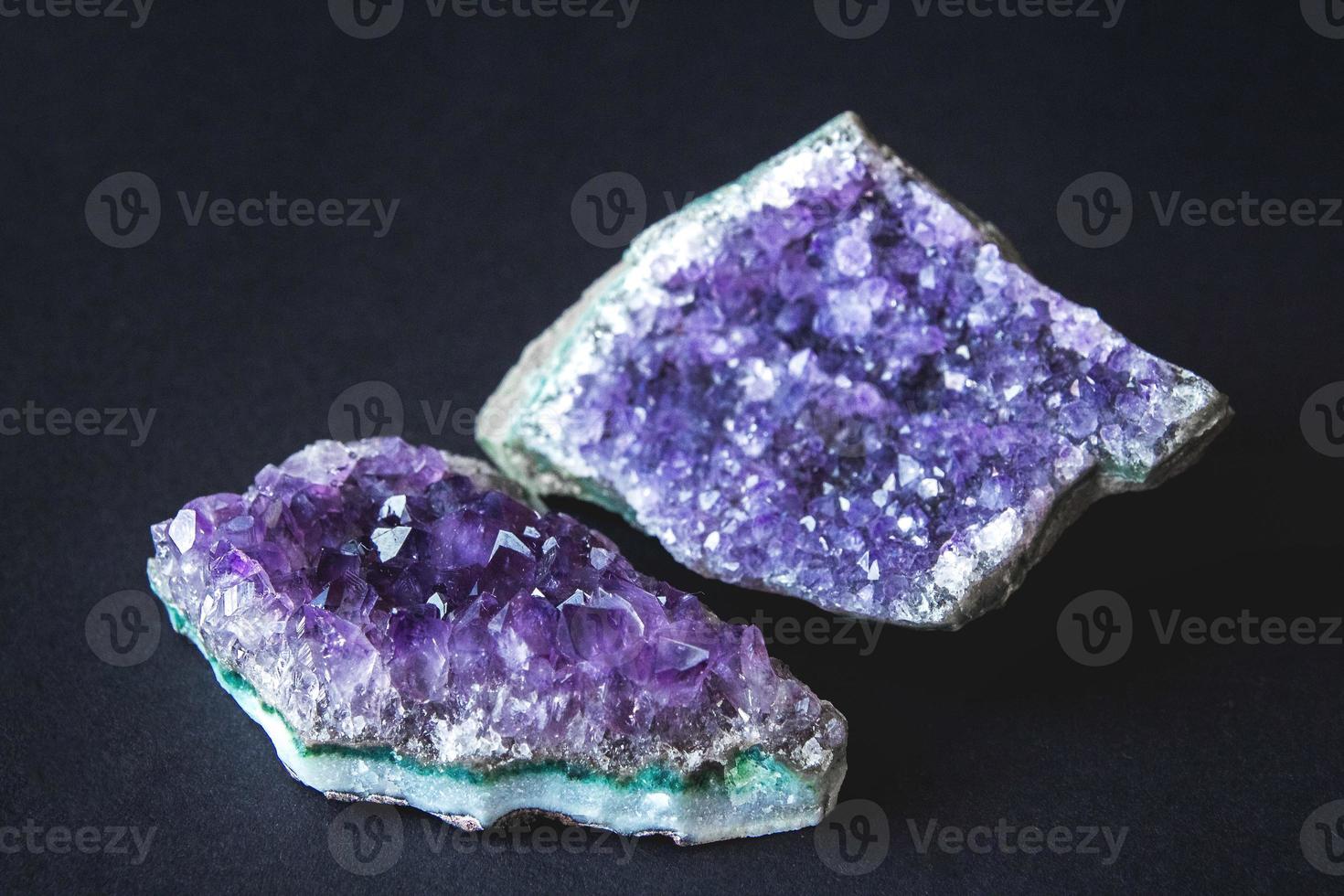 Amethyst stone druse crystals on a black background photo