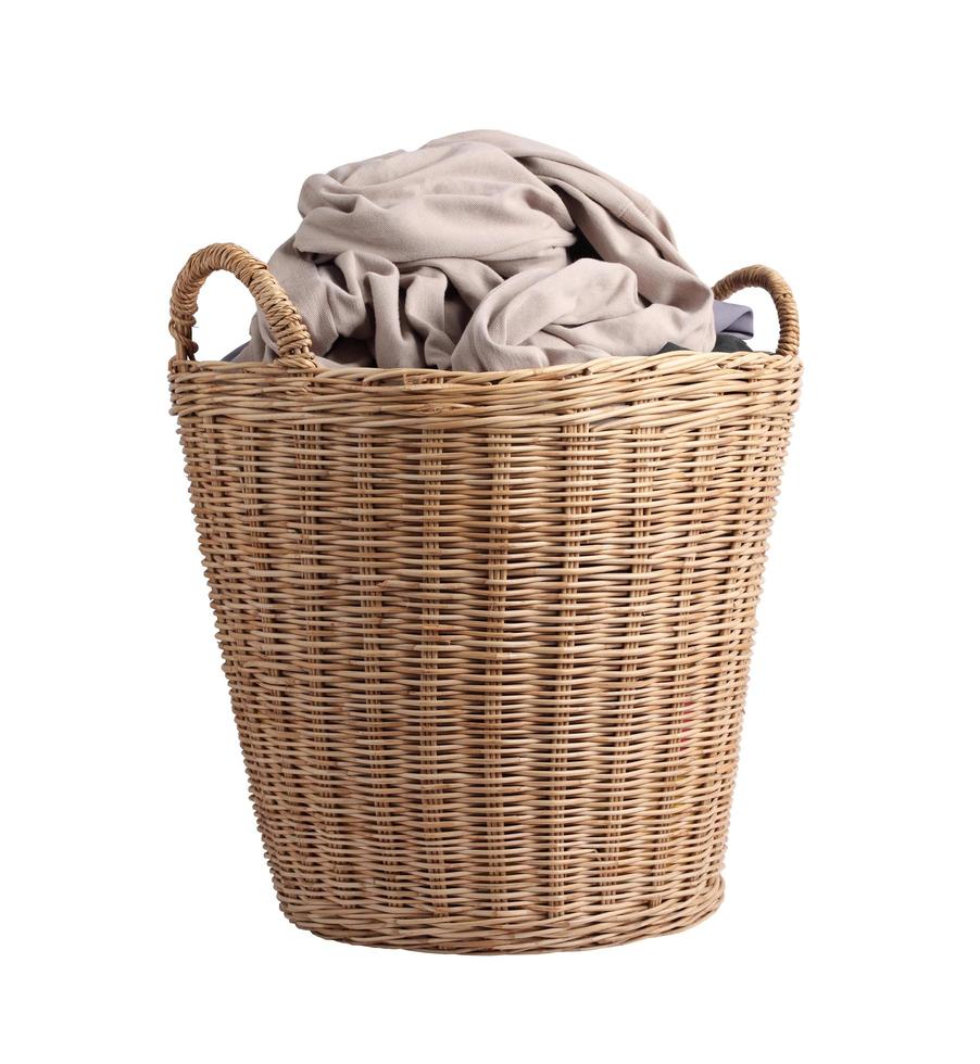 Basket with dirty laundry on white background photo