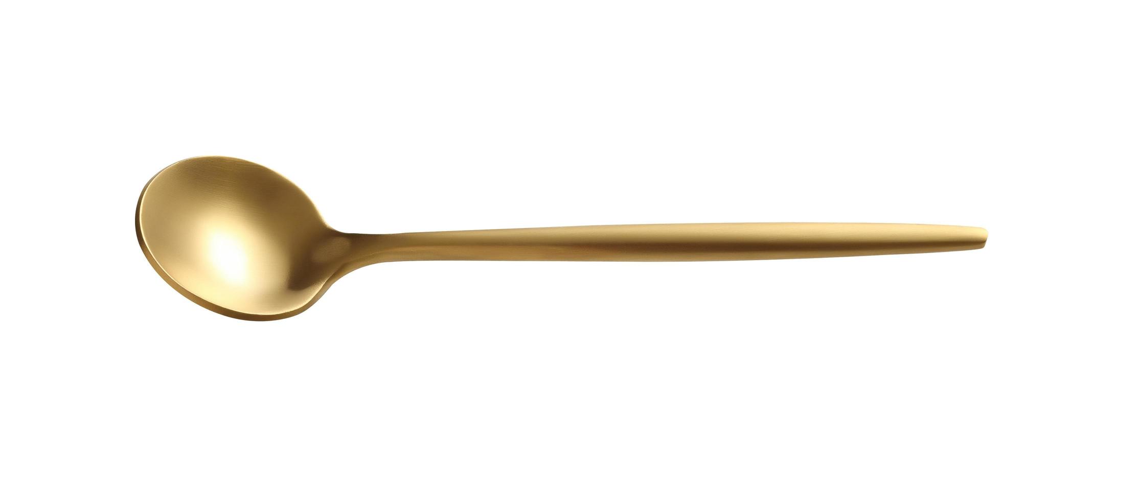 golden tea spoon on a white background photo