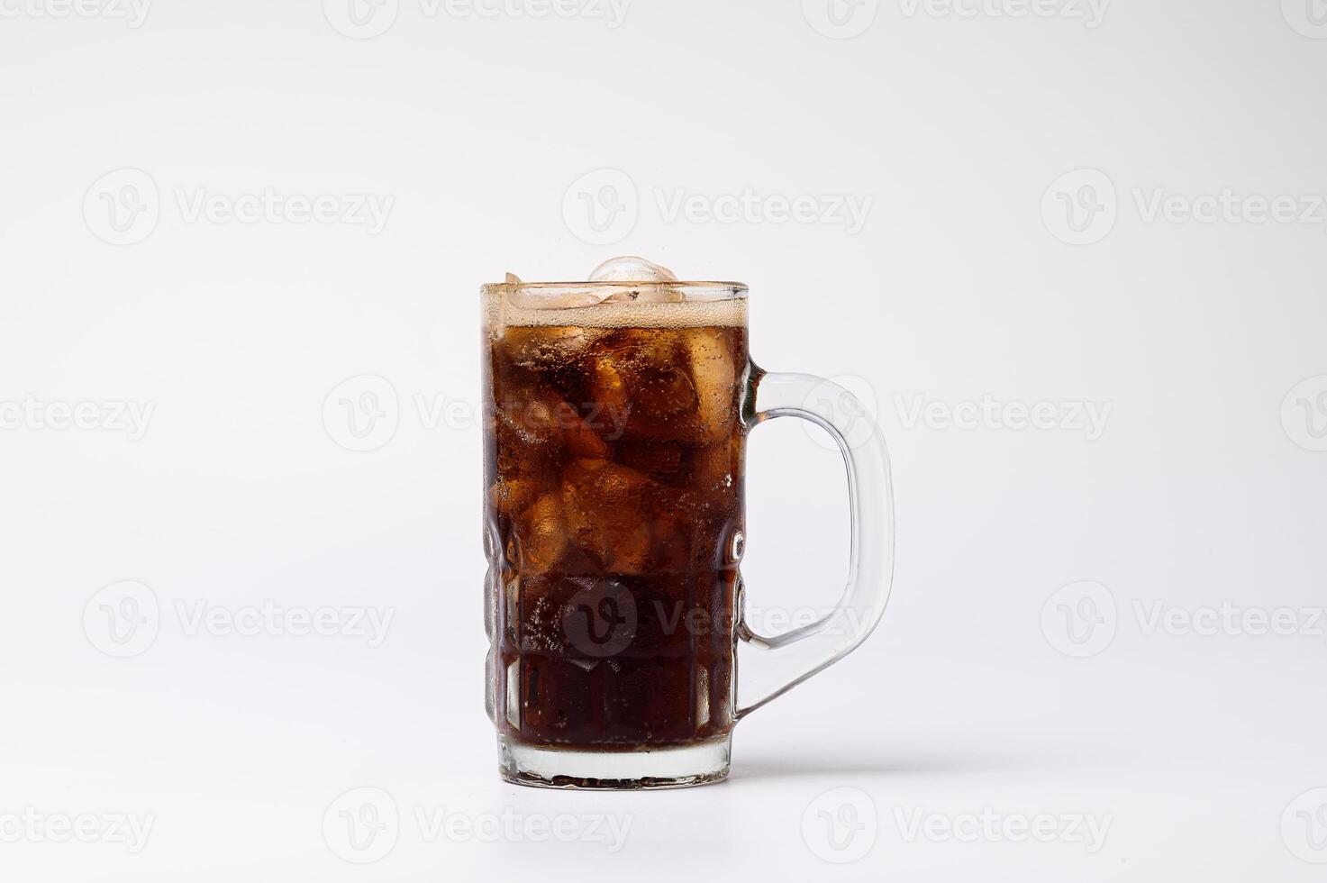 A glass of cola with ice and a straw photo
