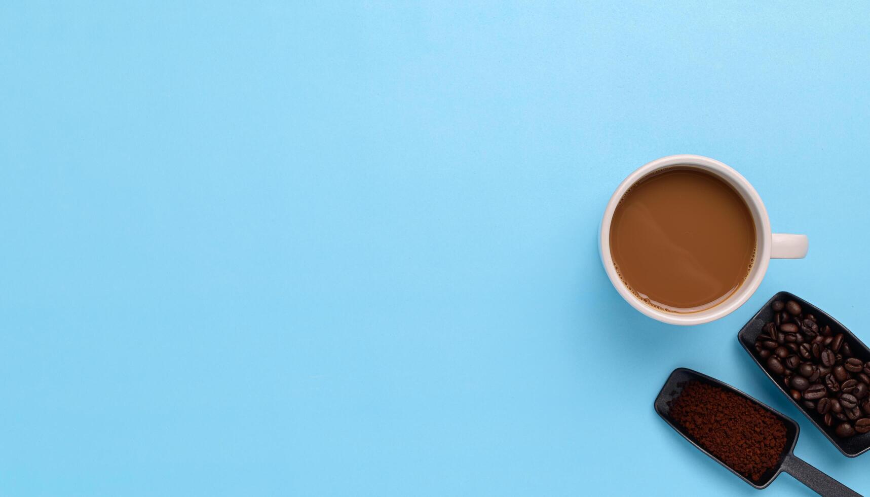 Coffee mug, coffee beans, ground coffee photo