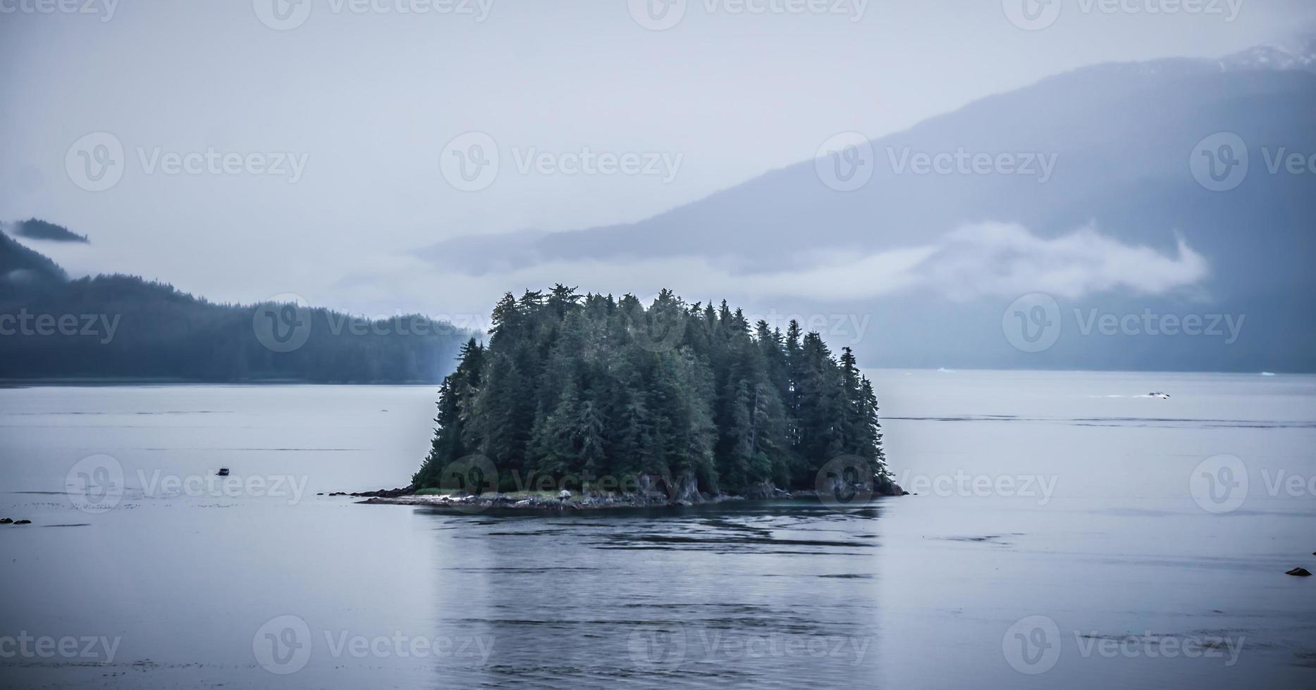 Alaska nature and mountain range with seascape in June photo