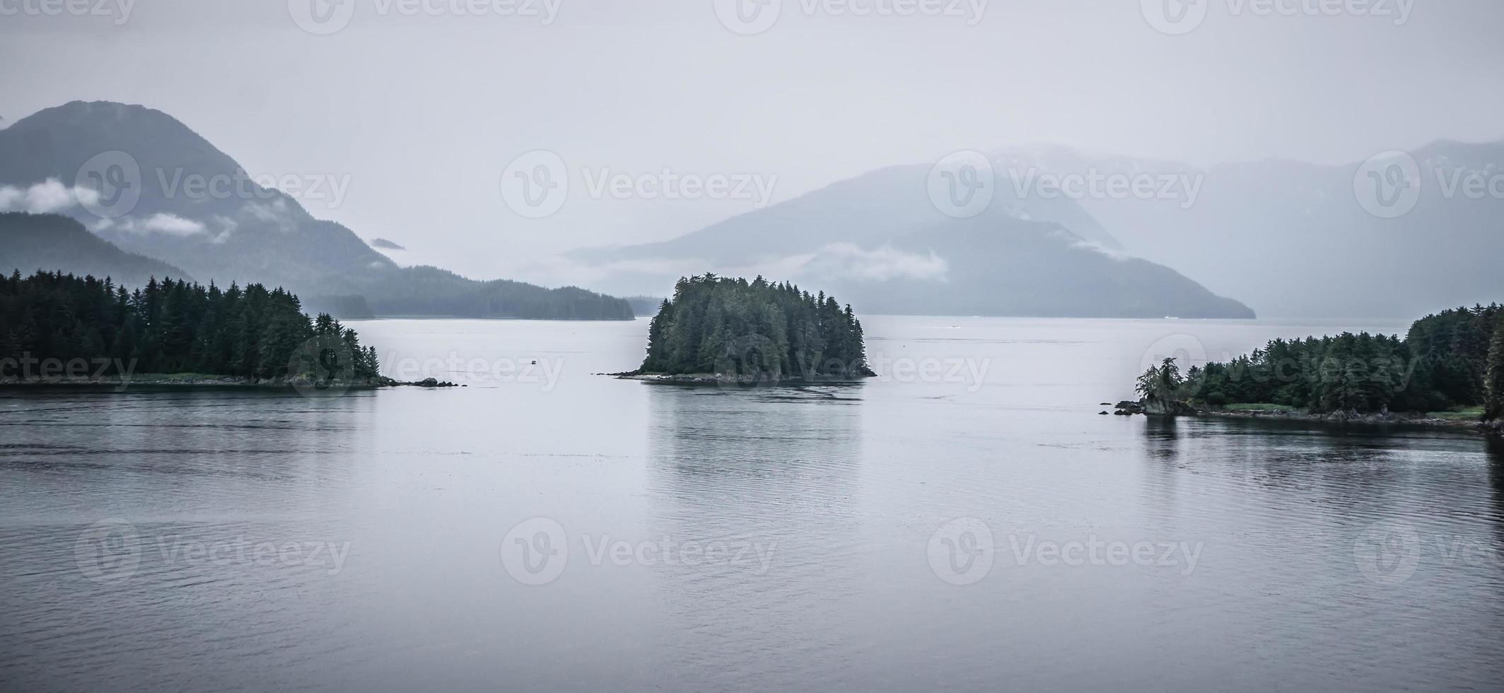 Alaska nature and mountain range with seascape in June photo
