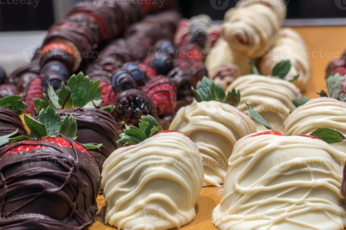 Chocolate covered strawberries on display in store photo