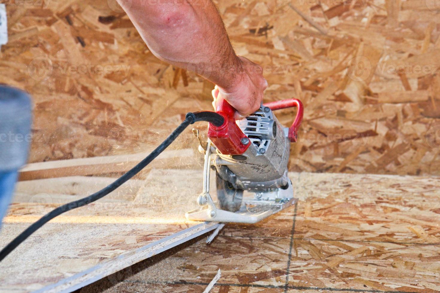 cutting OSB with skilsaw photo