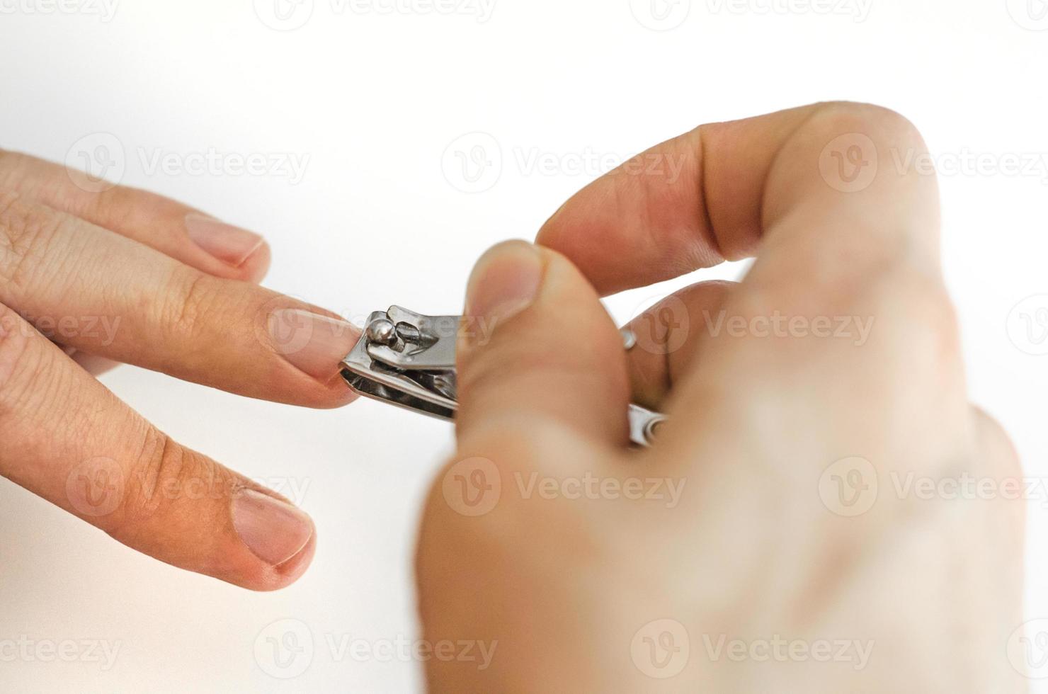 A young man does a manicure photo