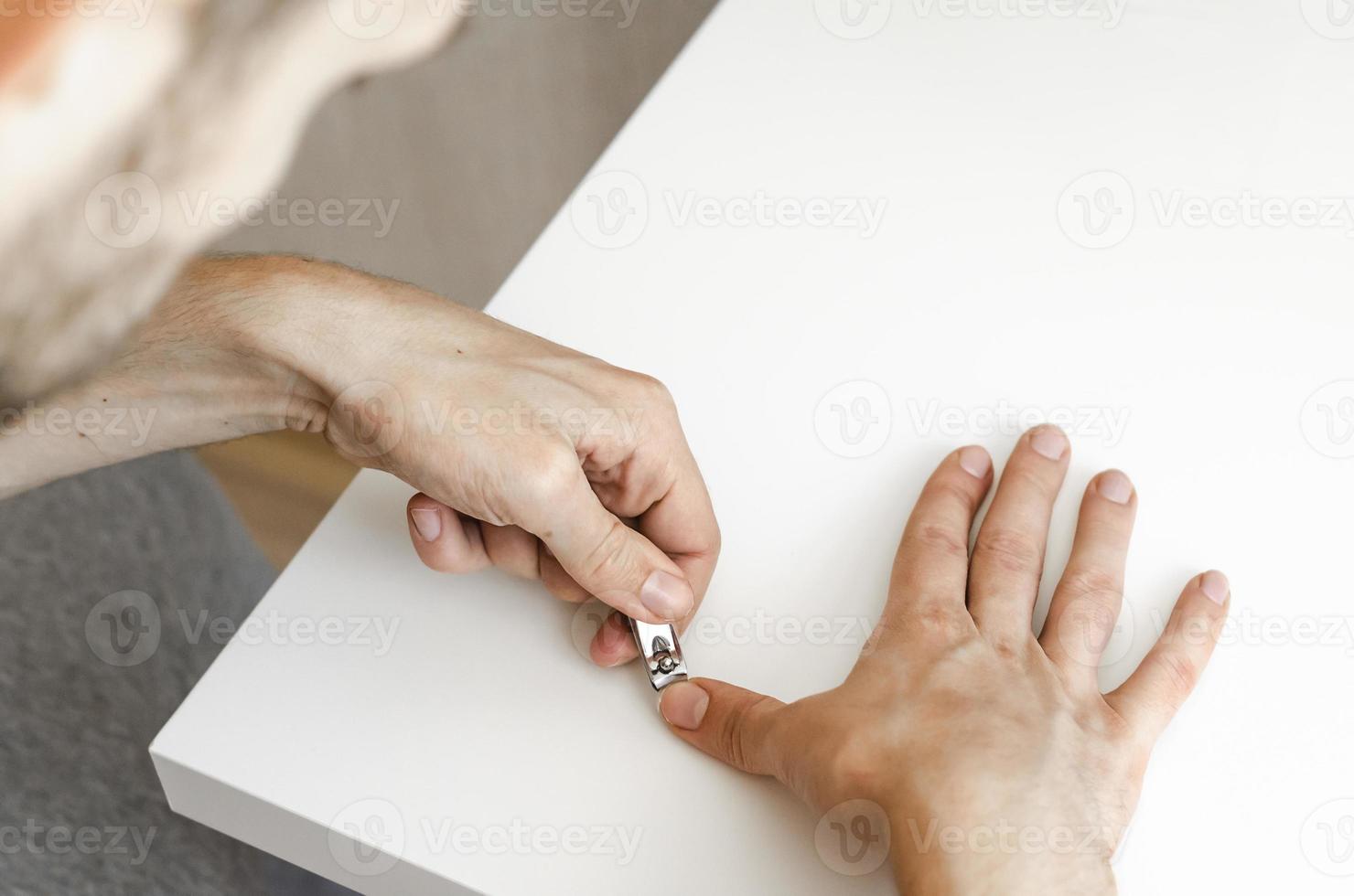 A young man does a manicure photo