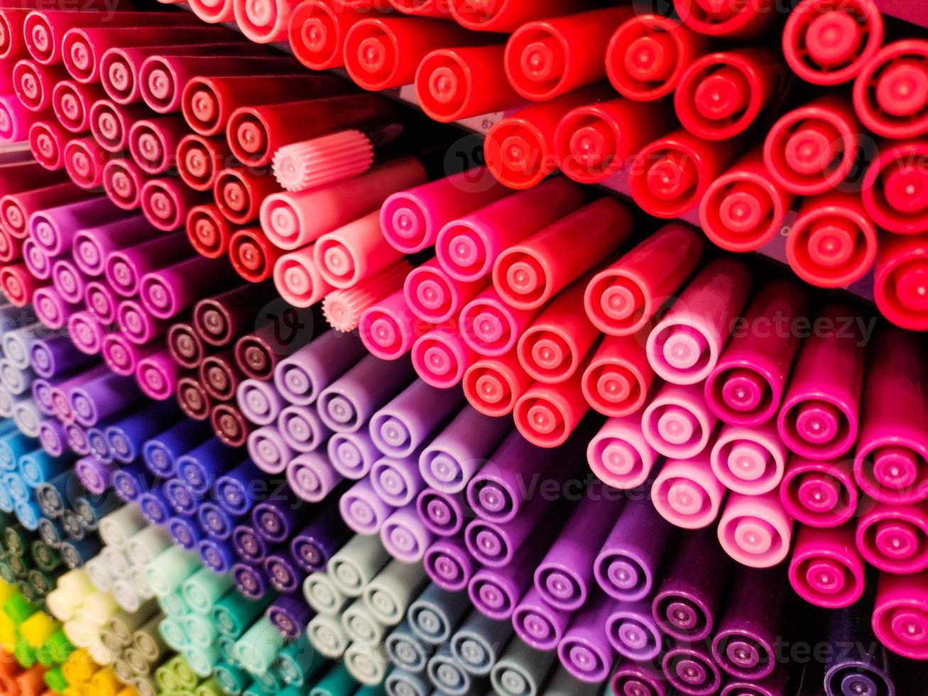 Colored pens in a lot of different colors photo