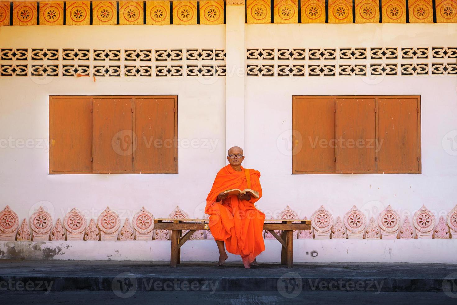 Monks in Thailand with a book photo