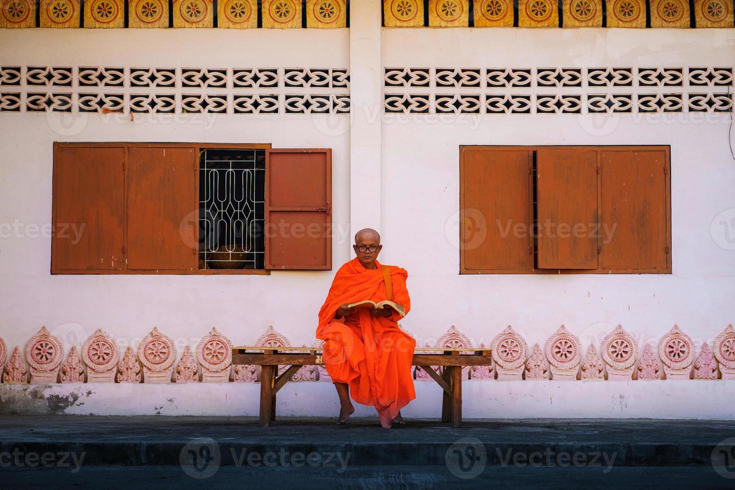 Monks in Thailand are reading books photo