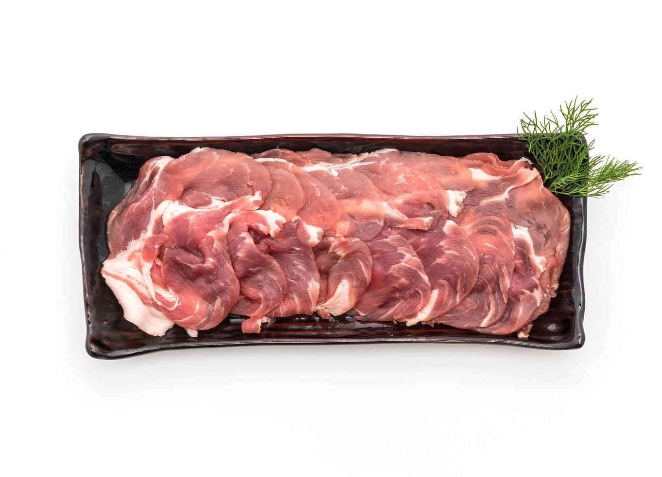 Fresh pork sliced with sauce on white background photo