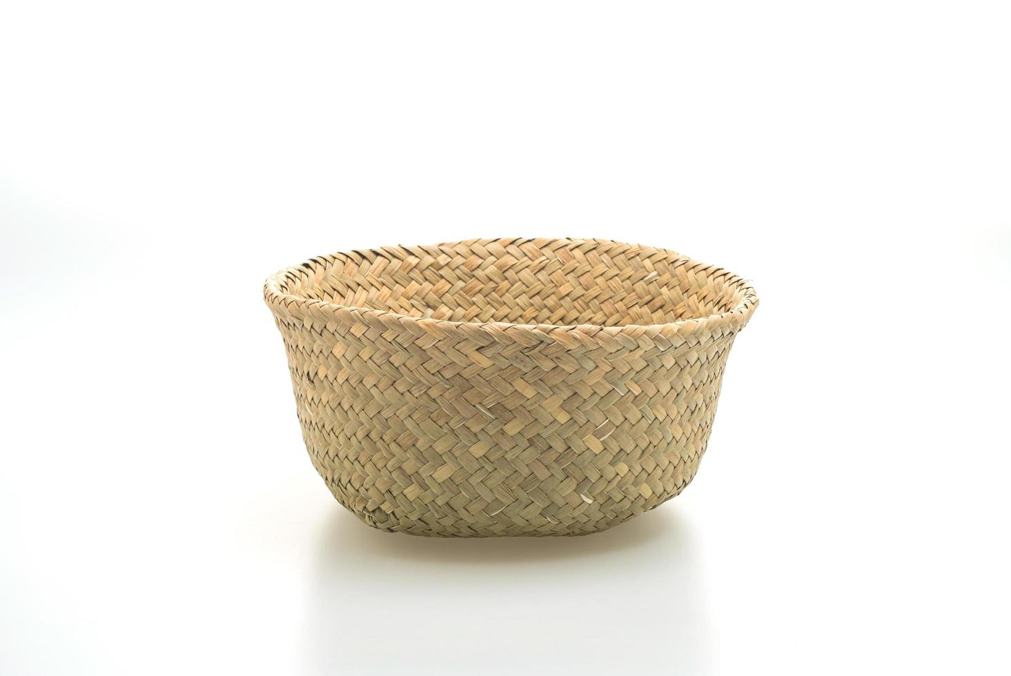 Wicker basket isolated on white background photo