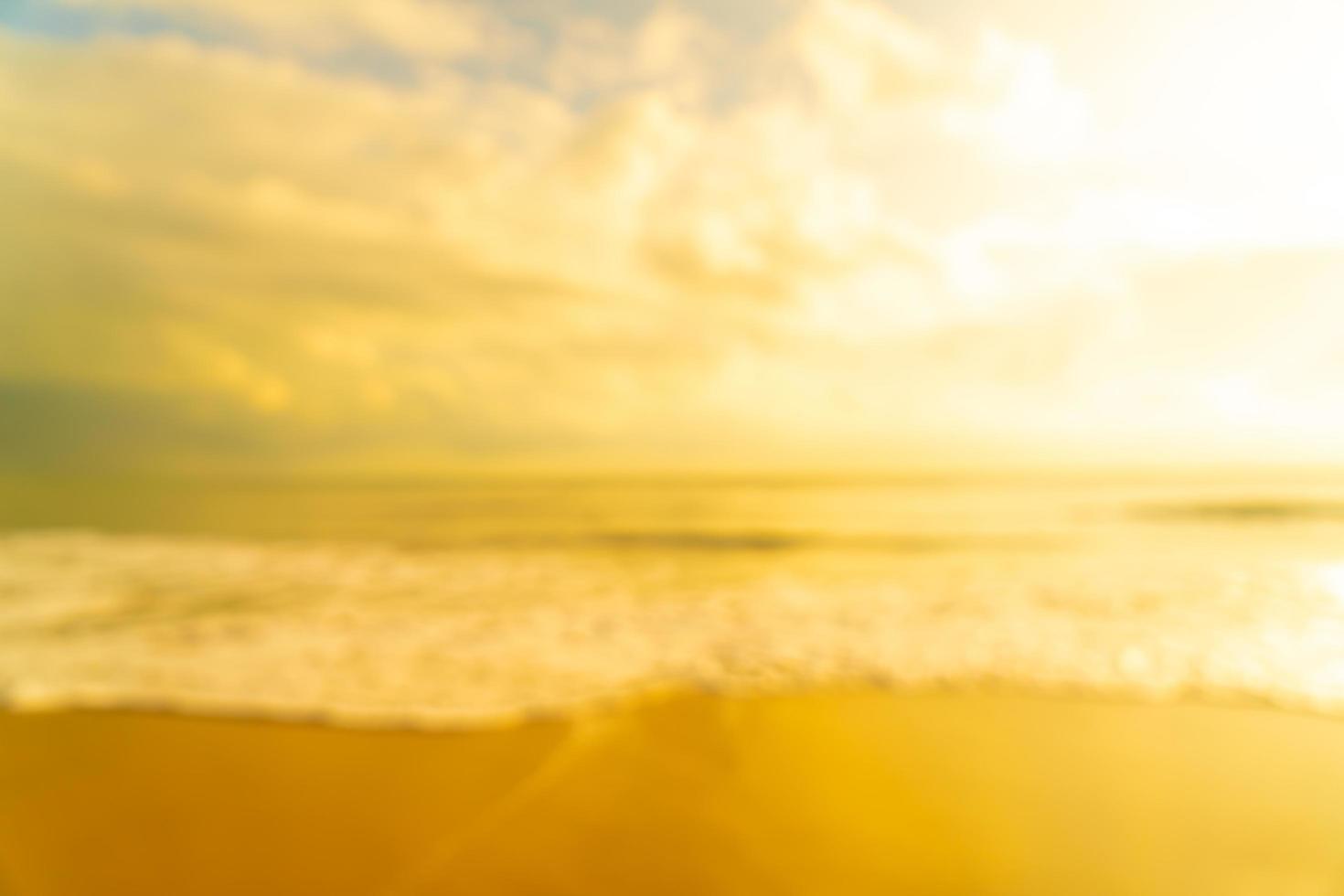 Abstract blur beach sea at sunrise or sunset time for background photo