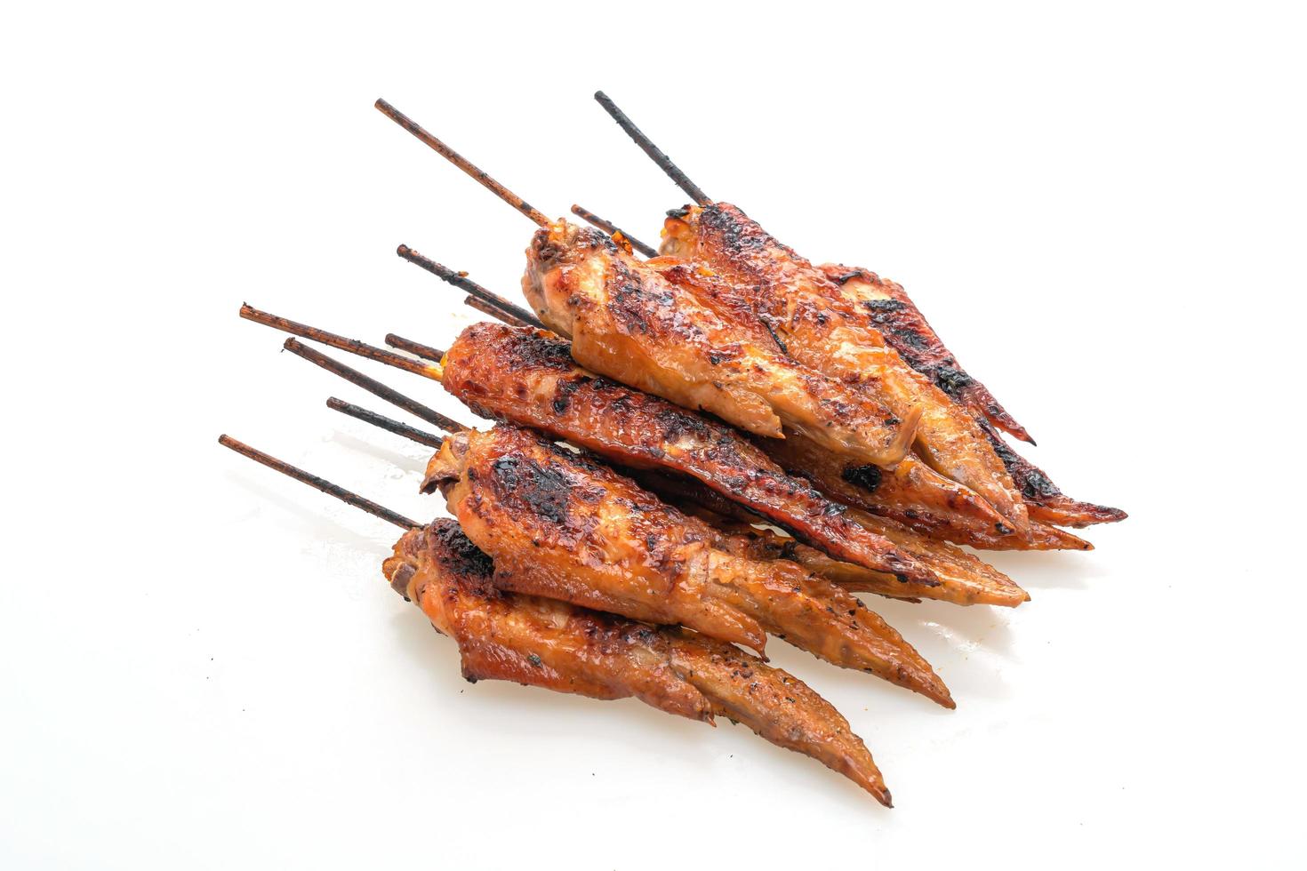 Grilled or barbecue chicken wings skewer with sticky rice photo