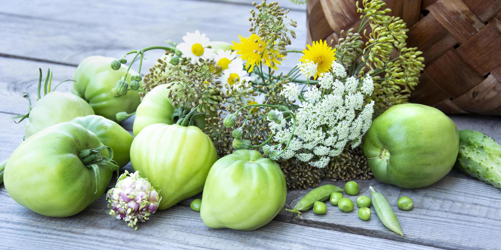 Vegetables in a wicker basket on a wooden background. Basket with photo