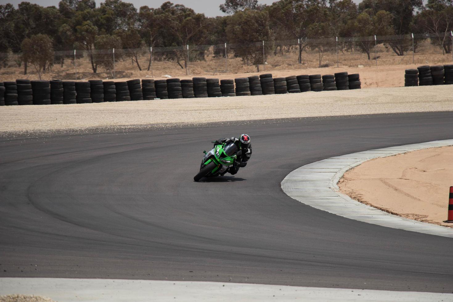 City, Country, MMM DD, YYYY - Motorcycle competition at a race track photo