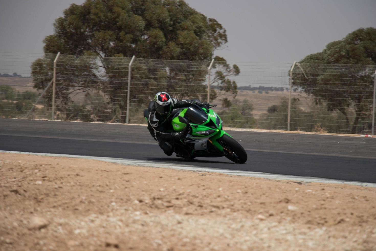 City, Country, MMM DD, YYYY - Motorcycle competition at a race track photo