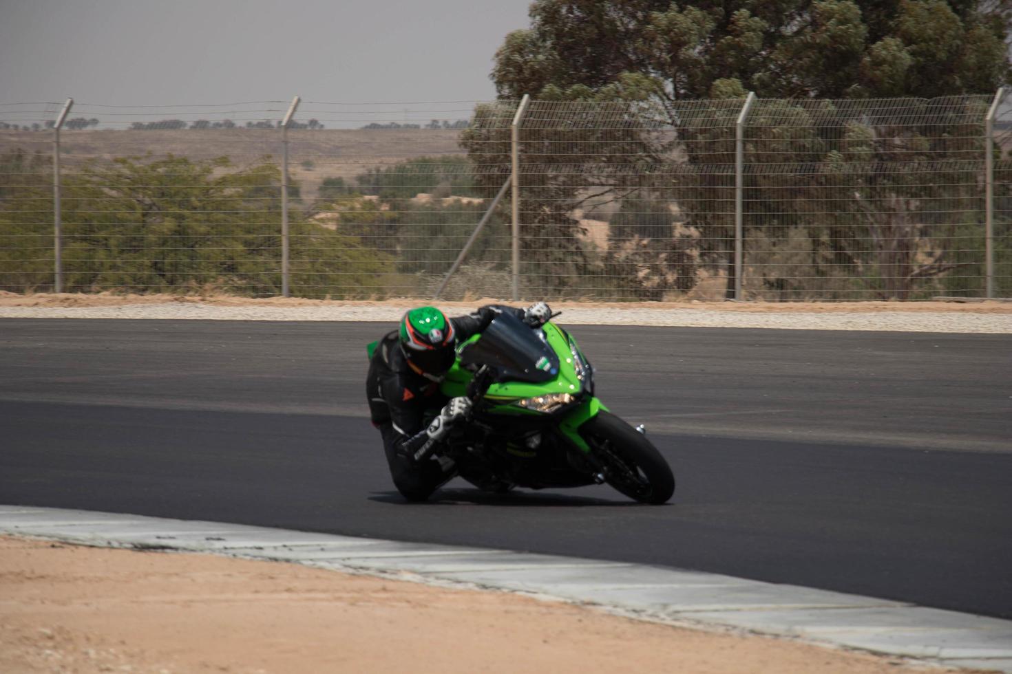 City, Country, MMM DD, YYYY - Motorcycle competition at a race track photo