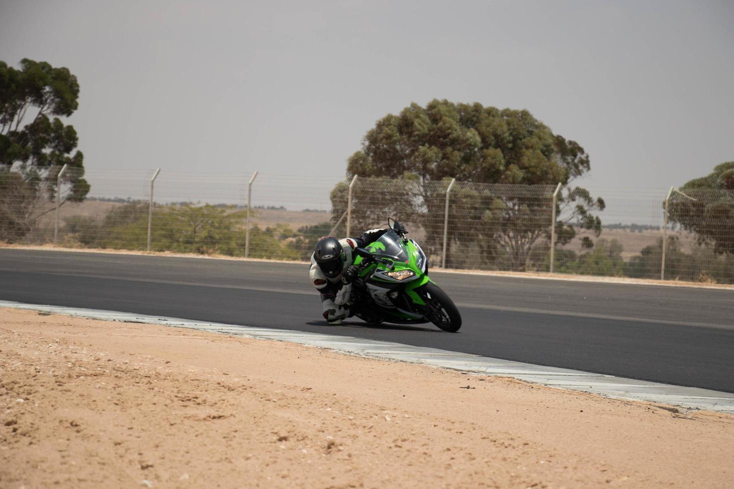 City, Country, MMM DD, YYYY - Motorcycle competition at a race track photo