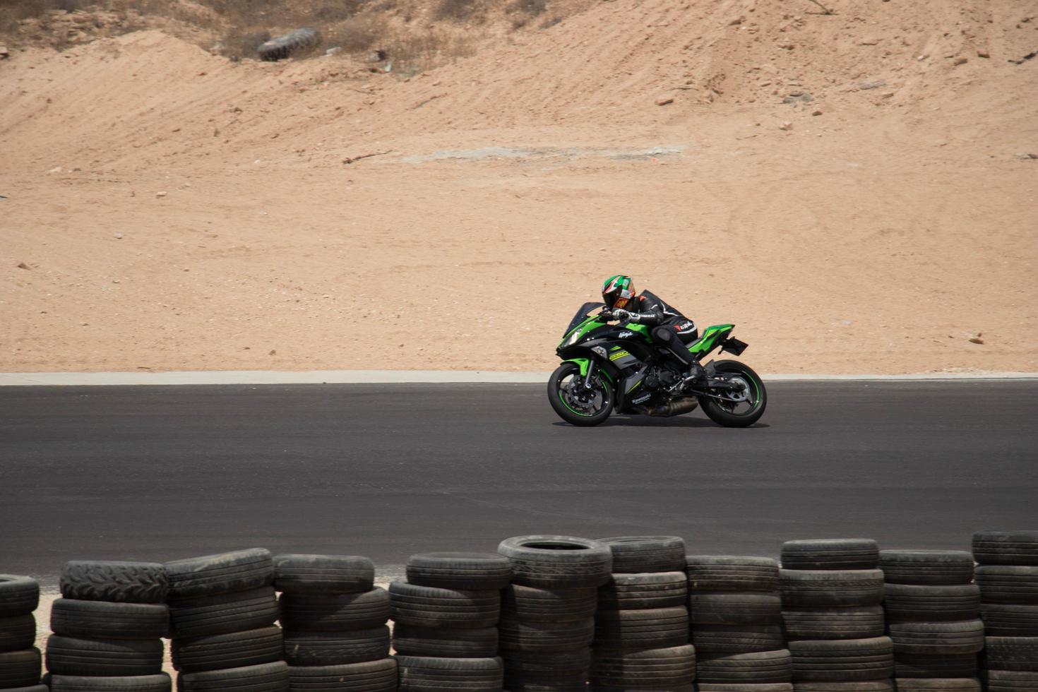 City, Country, MMM DD, YYYY - Motorcycle competition at a race track photo