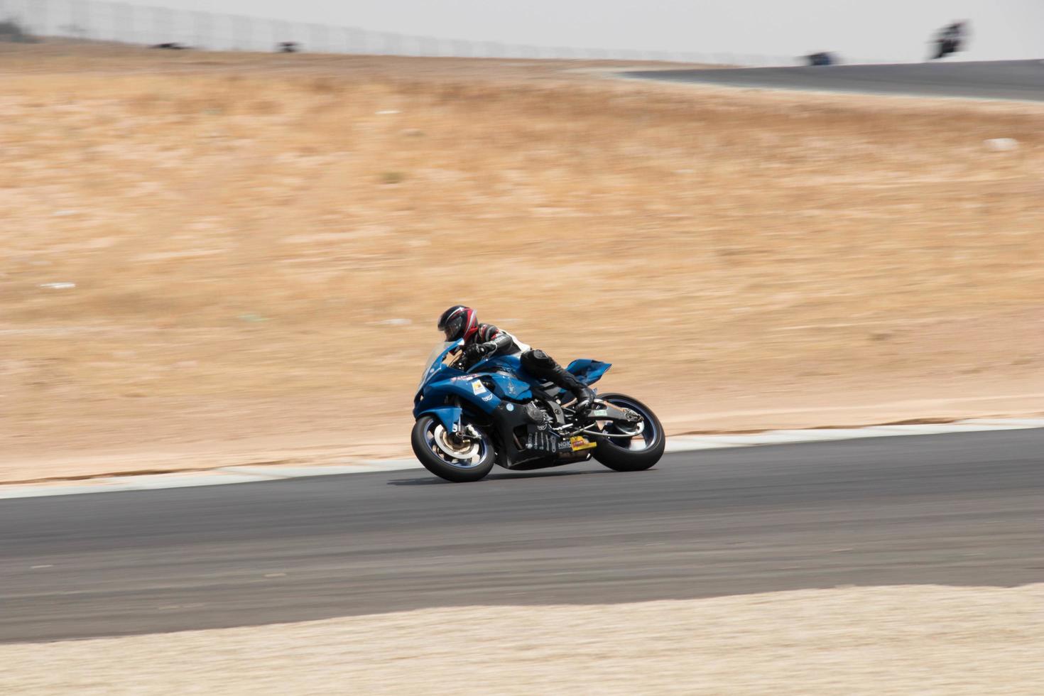 City, Country, MMM DD, YYYY - Motorcycle competition at a race track photo