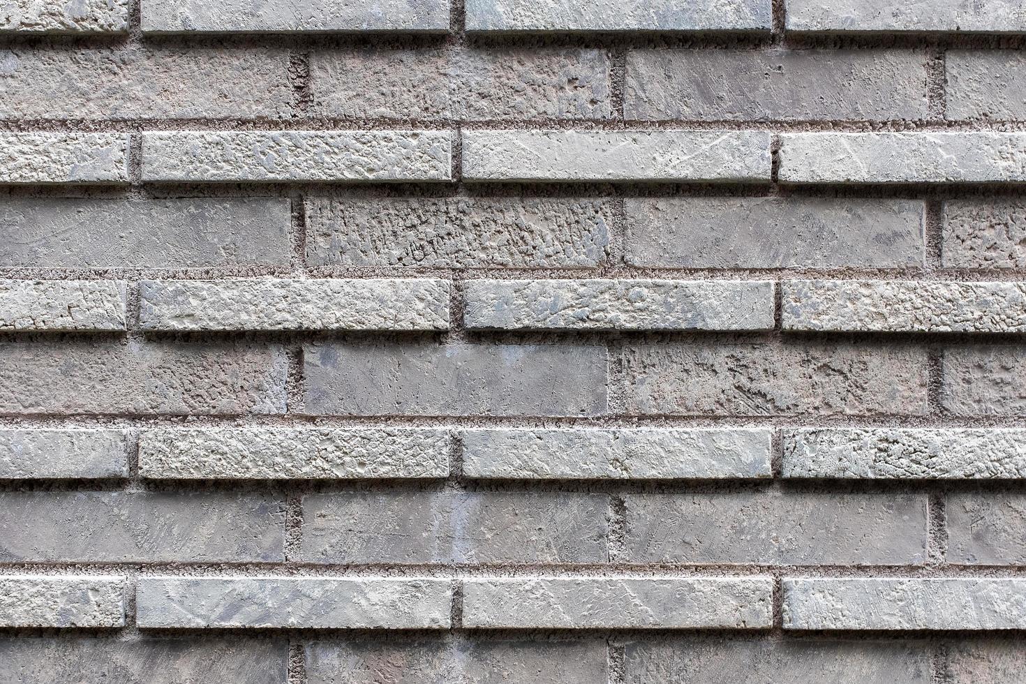 Closed up grey brick wall texture. photo