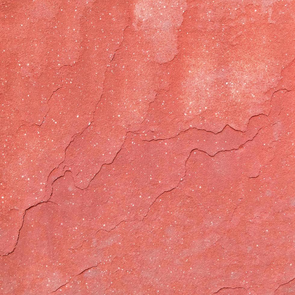 Red rough stone texture background. photo