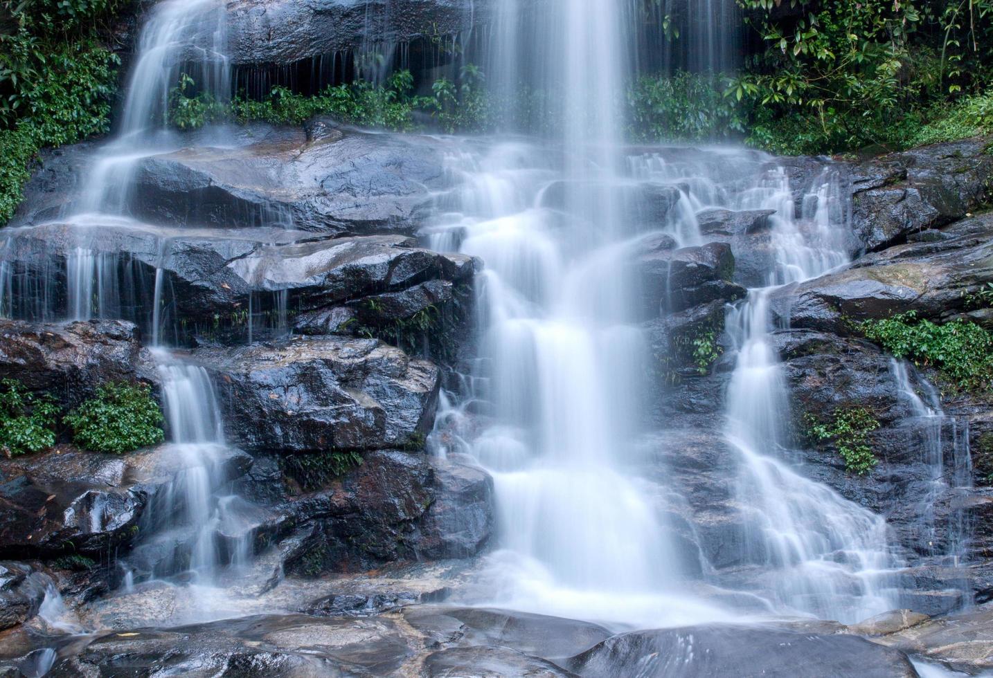 Water flowing at a beautiful waterfall photo