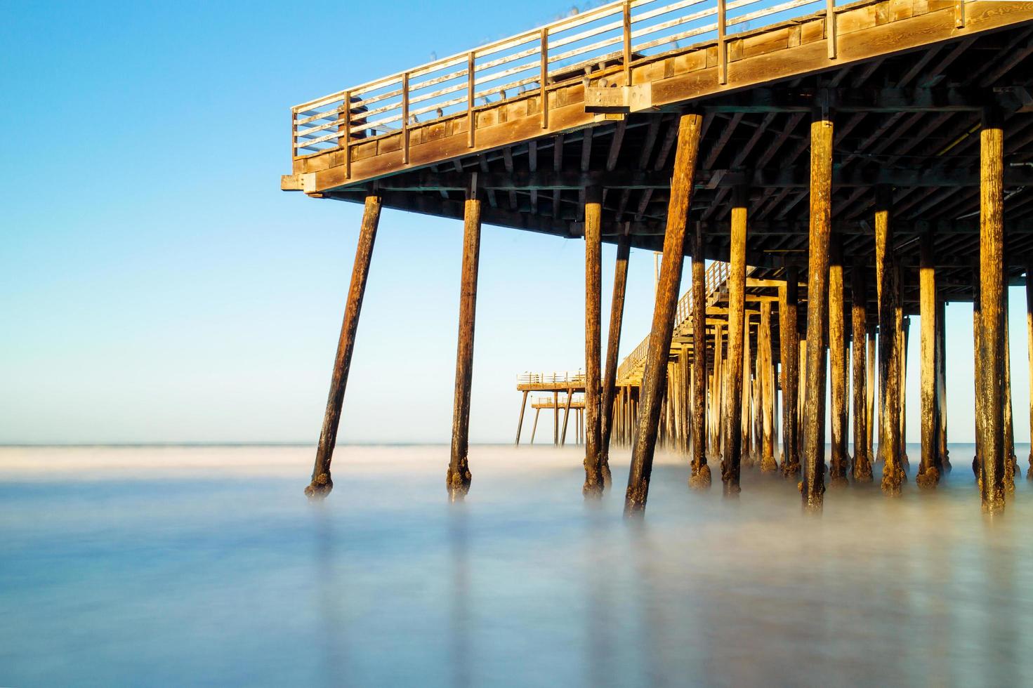 Old pier on the beach. photo