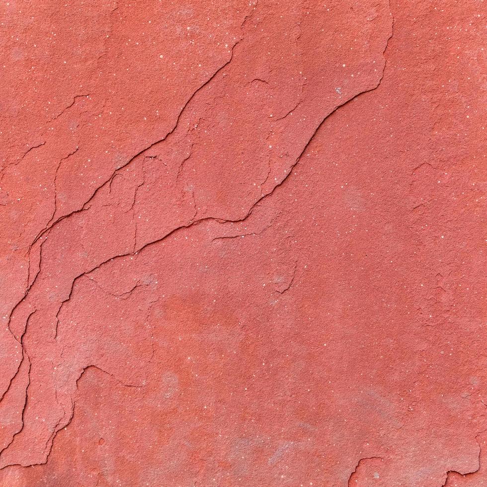 Fondo de textura de piedra rugosa roja. foto