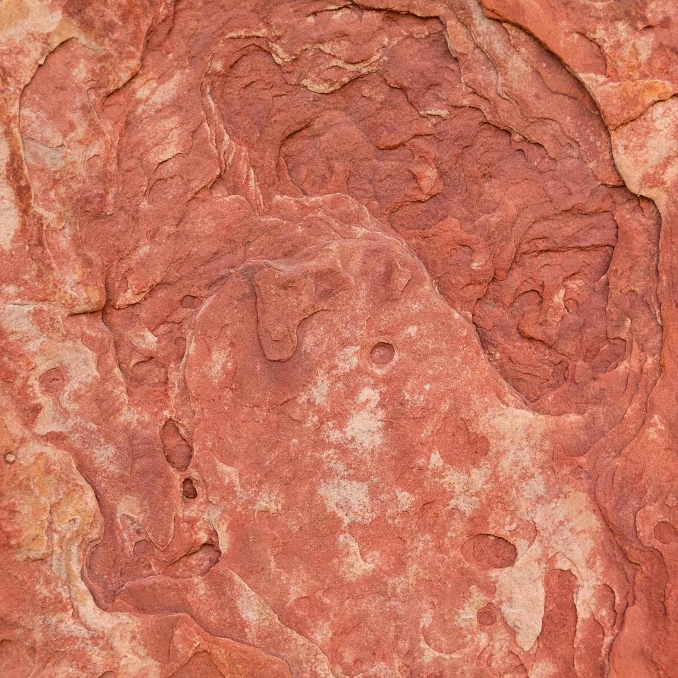 Red rough stone texture background. photo