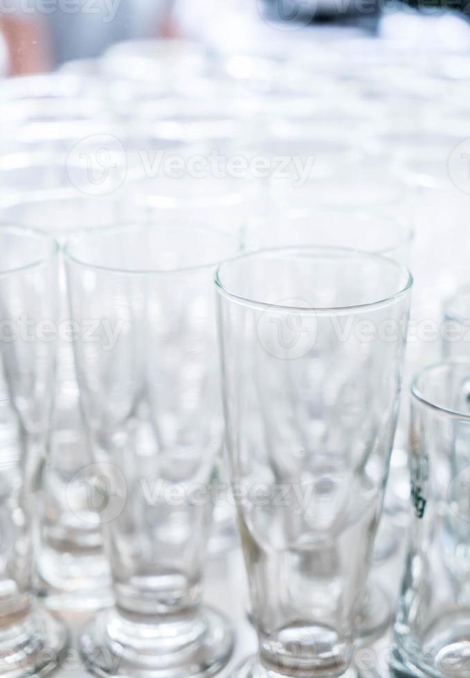 Many empty glasses in a line photo