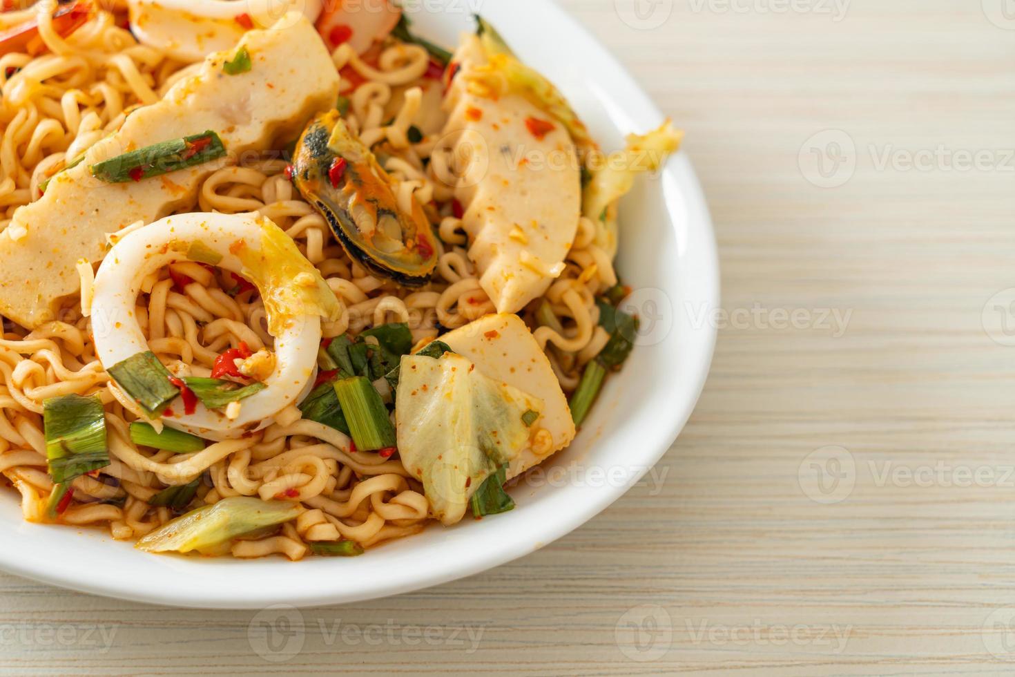 Instant noodle spicy salad with mixed meats photo