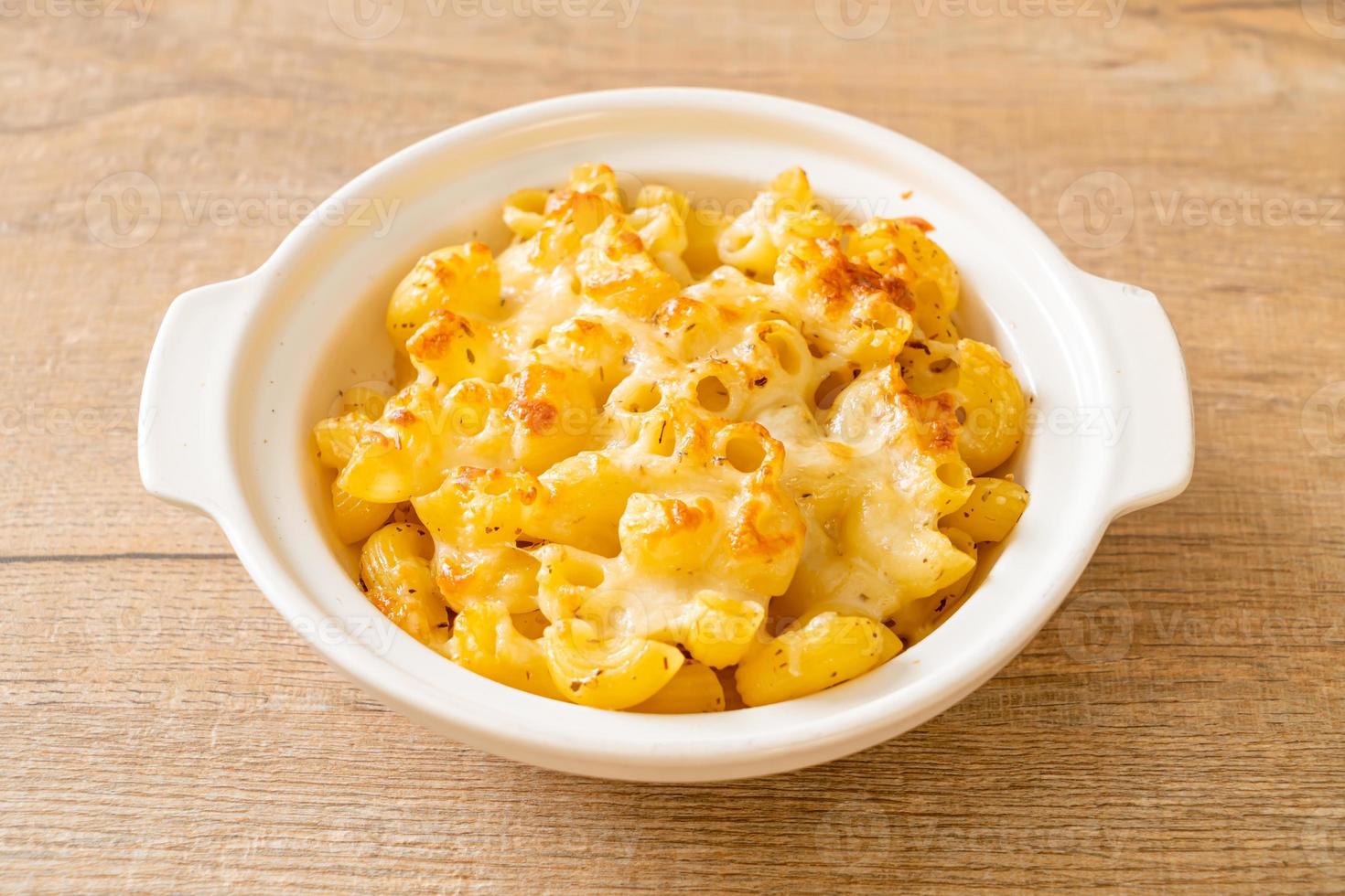 American mac and cheese, macaroni pasta in cheesy sauce photo